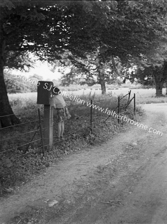 CHILD AT LETTERBOX